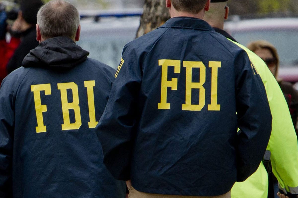 Federal agents at work, representing Lauth's collaboration with the FBI and law enforcement on missing persons cases